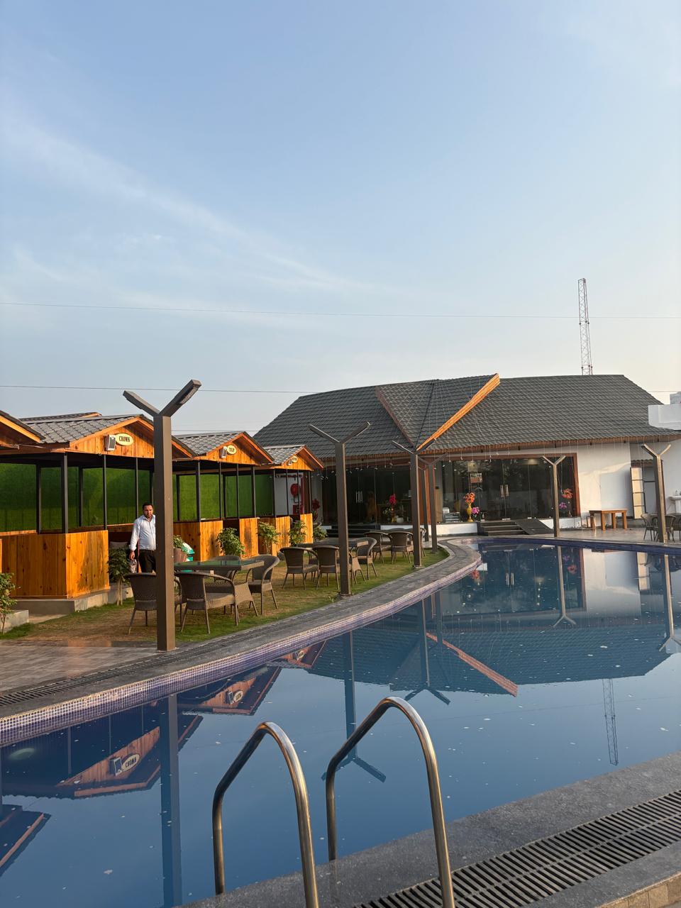 Wooden cabanas by the pool at Barrel & Bed