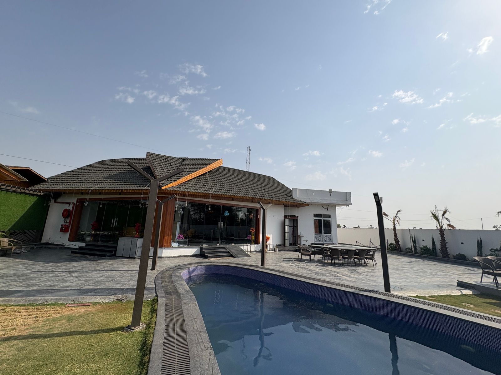 Luxury pool with patio facilities at Barrel & Bed